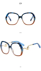 Detailed view of women large frame anti-blue light glasses with gradient frame and pearl detail.