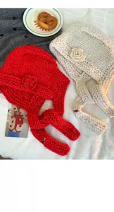 Handmade crochet thick yarn 3D flower balaclava knit hat detail showing cozy winter style.