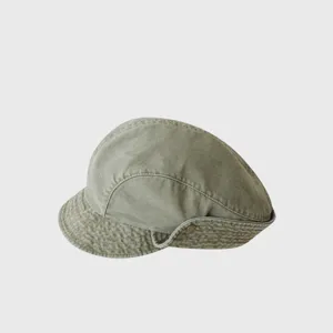 Vintage washed canvas newsboy cap for women, retro rolled brim beret hat, stylish detail view.