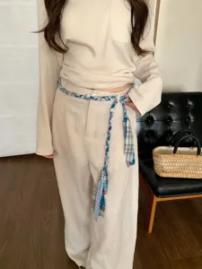 Retro ethnic style braided rope belt with blue plaid fabric, tassels, and pearls for women.