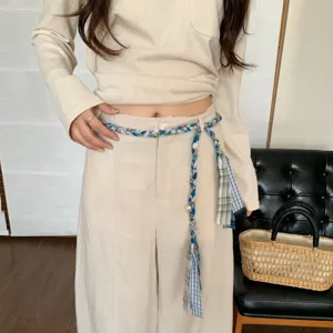 Retro ethnic braided rope belt for women, stylish tassel waist chain accessory for dresses.