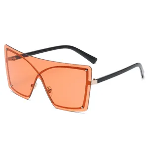 Gafas de sol enterizas sin montura grandes para hombre y mujer, estilo urbano de calle color naranja.
