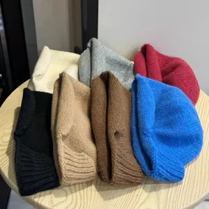 Close-up of colorful knit fisherman hat, cozy autumn winter solid color warm bucket hat.