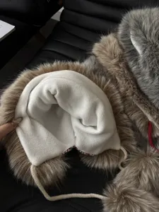 Thick winter warm plush trapper hat with soft fleece lining and fluffy faux fur trim.