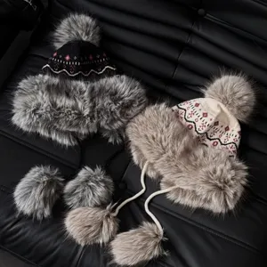 Winter ethnic jacquard ushanka trapper hat with warm plush earflaps and fluffy pom poms.