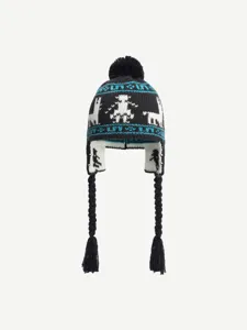Detailed view of the winter warm knitted earflap hat with fair isle jacquard pattern.