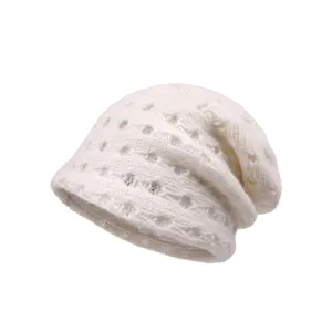 Detailed view of the white knitted slouchy beanie, featuring a double-layer mesh design.