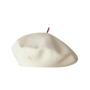 Women's chic white wool beret hat, vintage French painter style with red top detail and side button design.
