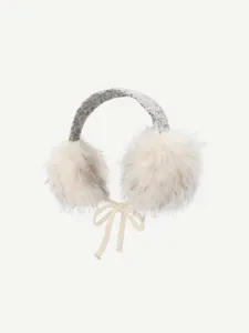 Fluffy earmuffs detail shot, soft plush ear warmers with cute bow, winter cozy accessory.