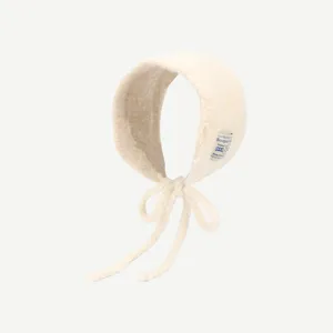 Bonnet tricoté pour femme hiver chaud cache-oreilles avec liens unicolore coupe-vent élégant et doux.