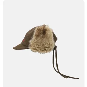 Retro brown plaid winter trapper hat with plush earflaps and long strings for warm outdoor wear.