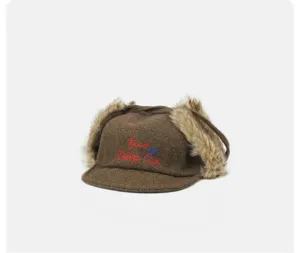 Retro brown plaid earflap baseball cap with warm faux fur trim and chic front embroidery.