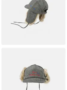 Detailed view of the vintage herringbone tweed trapper hat with cozy faux fur ear flaps.