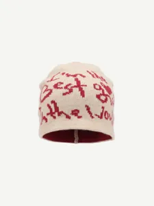Detailed shot of knitted winter beanie, American streetwear style letter patterned pullover warm cap.