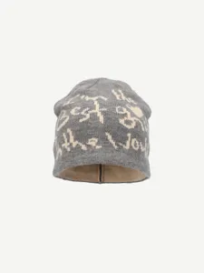 Close-up detail of the grey knitted beanie hat featuring white woven slogan text design.