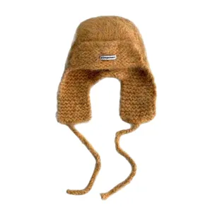 Fluffy mohair trapper hat with earflaps and ties, warm winter knitted aviator hat for travel.