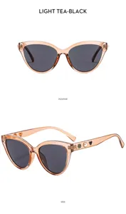 Chic women's cat-eye sunglasses featuring elegant pearl, camellia, and heart temple details.