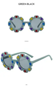 Details of cute kids floral sunglasses featuring colorful heart stickers and green frame design.