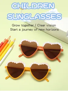 Close-up detail of children heart sunglasses with cute floral decal and gradient frame.