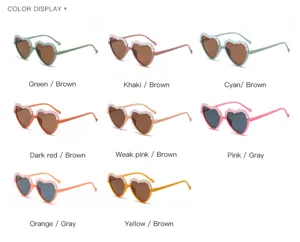 Children heart-shaped sunglasses detail display, cute floral trim, multiple color options.