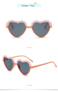 Kids heart-shaped sunglasses with floral details, orange and gray UV protection eyewear.