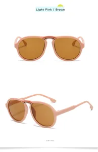 Children's cute sunglasses with large pink frames and brown lenses featuring a sweet rainbow detail.
