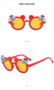 Detailed view of cute kids sunglasses in red with cat ears and blue bow, yellow lenses.