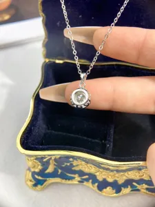 Moissanite S925 sterling silver pendant necklace close up detail showing sparkling stone setting.