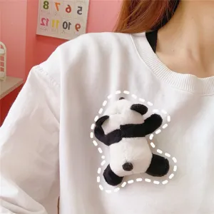 Cute plush panda brooch detail view, soft fluffy doll accessory for clothes and bags.