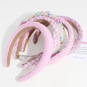 Detail view of sweet pink tweed padded headband, Korean style wide brim hair accessory for women.