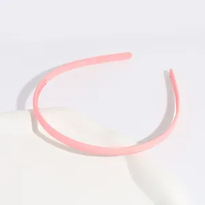 Pink matte plastic headband with teeth, slim non-slip hair accessory for daily casual styling.