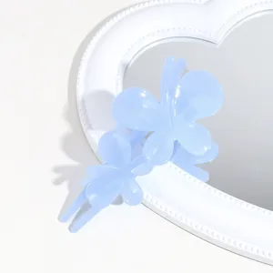 Blue butterfly hair claw detail shot, frosted texture hair clip for daily elegant hairstyling.