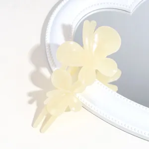 Elegant frosted butterfly hair claw clip in light yellow, perfect for stylish daily hairstyles.