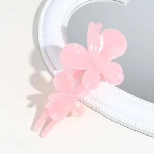 Pink butterfly hair clip for women, glossy resin hair claw for styling and daily wear.