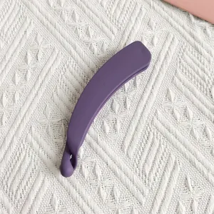 Matte purple banana hair clip detail shot, elegant styling accessory for women daily wear.