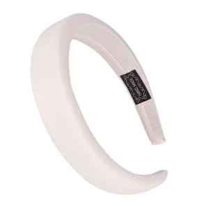 Detail shot of the minimalist wide padded fabric headband for women daily hair styling.