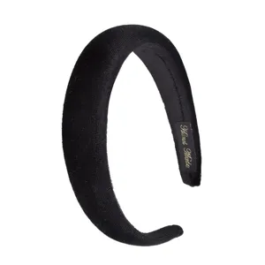 Detail shot of black velvet padded headband, soft texture, comfortable fit for daily hair styling accessories