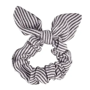 Detailed close-up view of the black and white striped hair scrunchie with cute bunny ears.