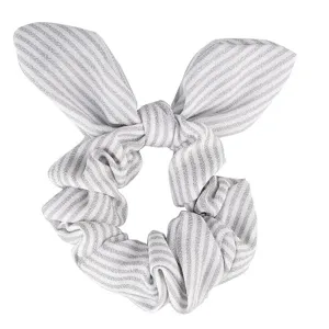 Closeup of grey white striped satin hair scrunchie with cute rabbit ears and elastic band.