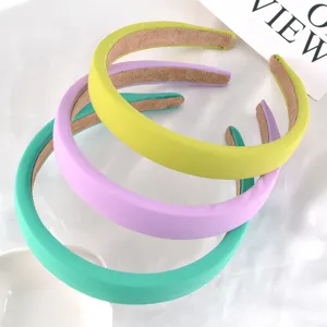 Detailed shot of pastel colored sponge hair bands set, soft fabric wrapped hoops for daily use.