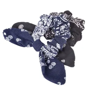 Detailed view of fashionable fabric hair scrunchie with bandana paisley pattern and cute bow.