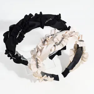 Wide rhinestone ruffle headband detail, elegant fashionable hair accessory for daily wear.