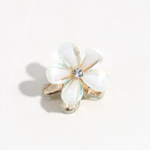 Mini flower hair claw clip with crystal rhinestones, cute metallic hair accessory for bangs.