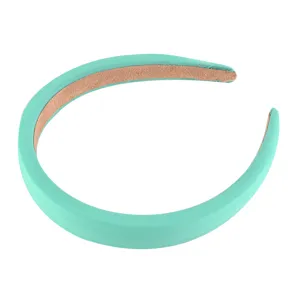 Mint green padded headband detail showing smooth fabric surface and soft inner lining structure.