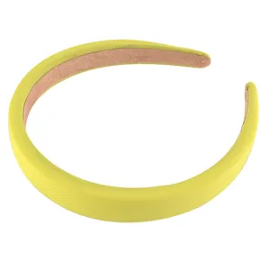 Detailed view of the yellow sponge headband, showing the fine fabric texture and neat stitching.