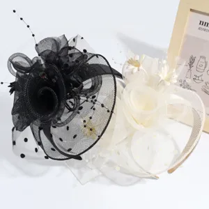 Close-up detail of elegant mesh veil feather headbands in black and white styles for parties.