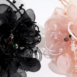 Exquisite detail view of court style flower feather headband, elegant party hair accessory.