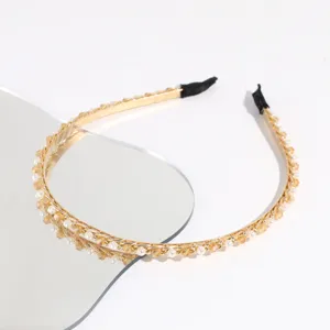 Detail shot of chic crystal pearl thin metal headband, elegant hair accessory for daily wear.