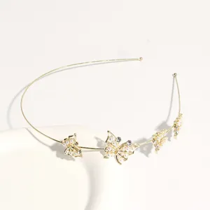 Ultra-thin gold headband detail, elegant rhinestone and pearl butterfly charms design.