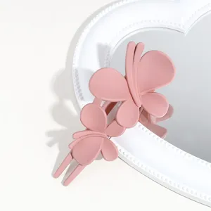 Matte pink butterfly hair claw clip for elegant daily hairstyles and chic ponytails.